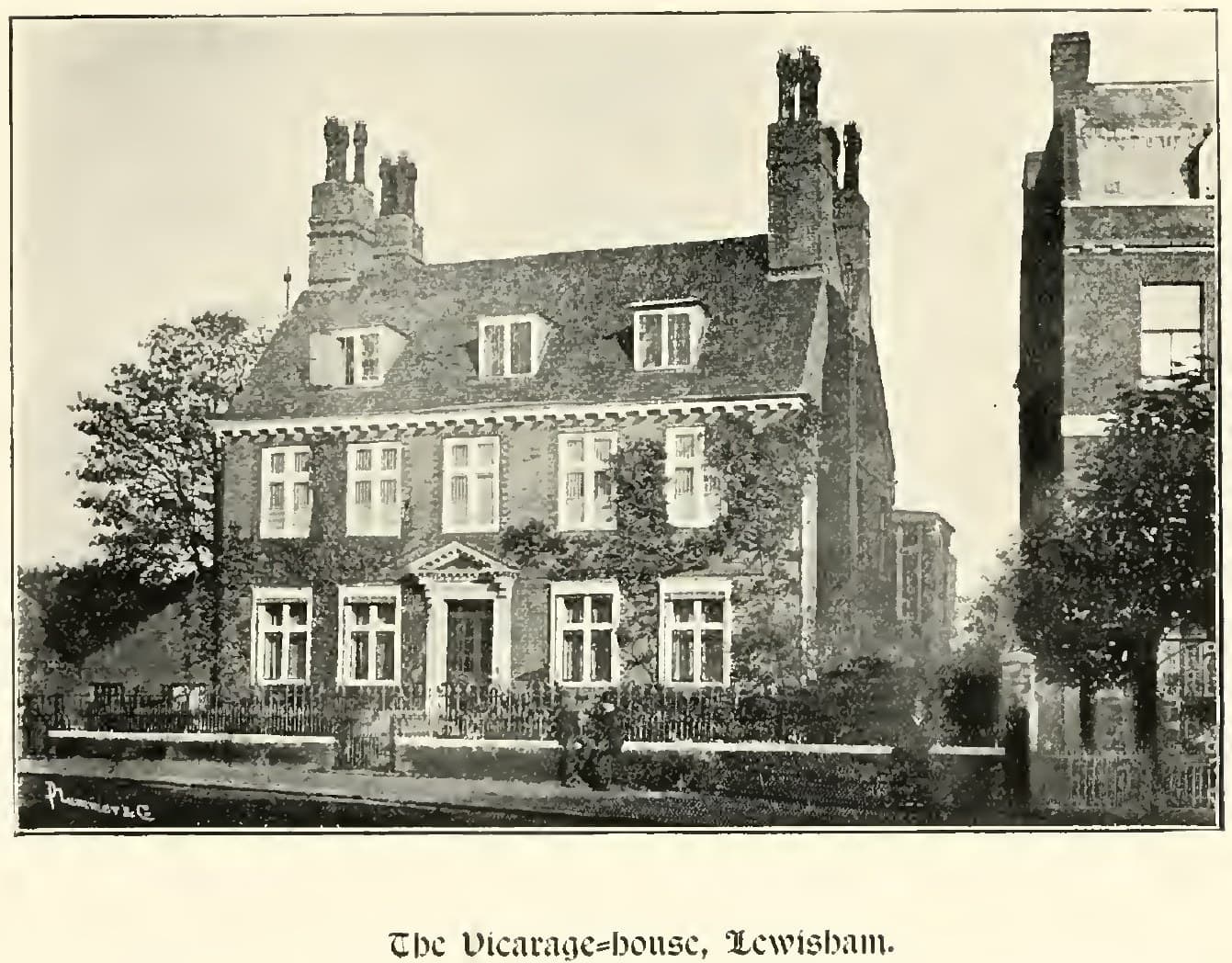 A photograph of a large ivy-covered brick house of about 1690 behind railings, with dormer windows and tall chimneys.