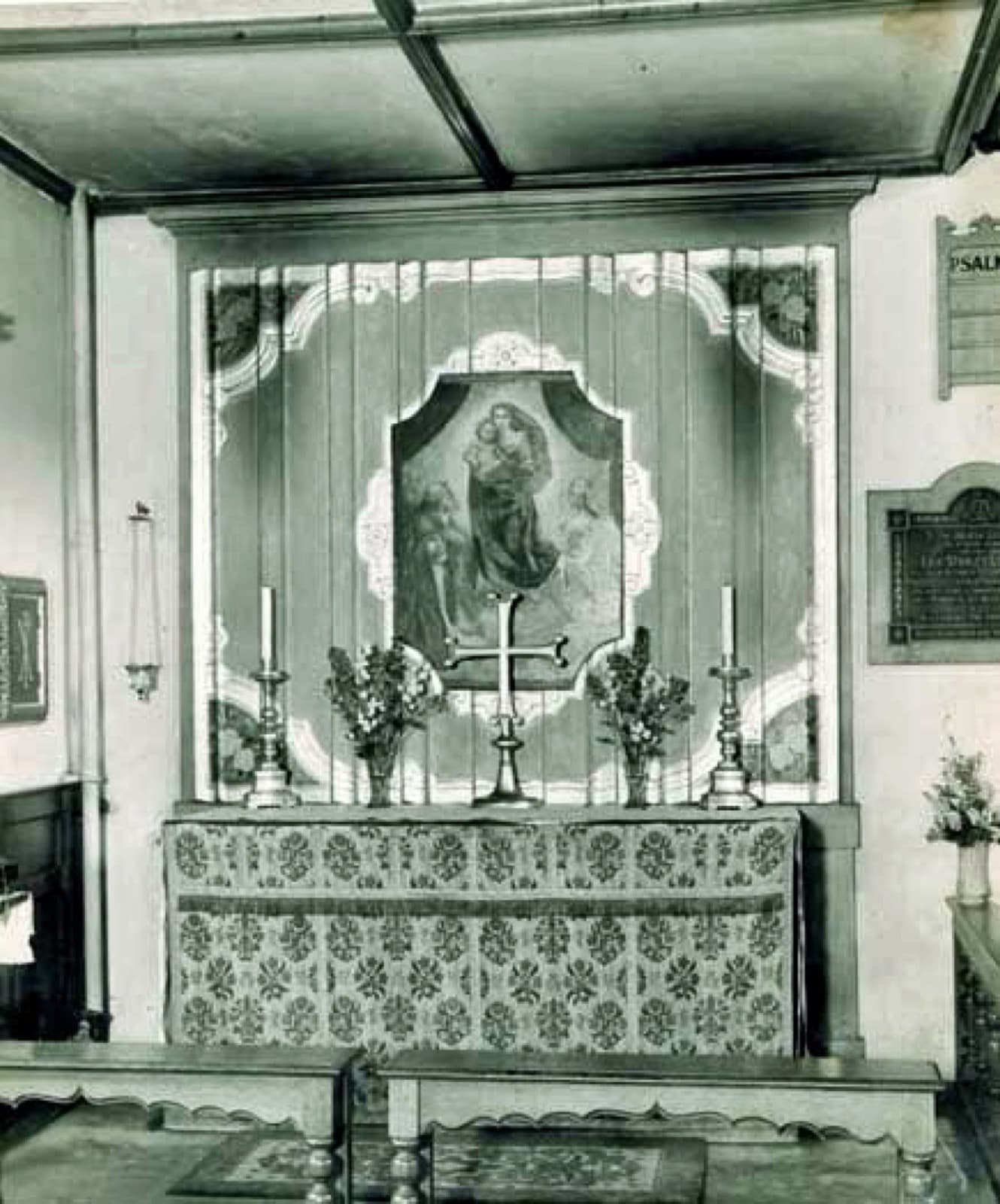 The Lady Chapel, with a painted reredos beneath a decorated arch.