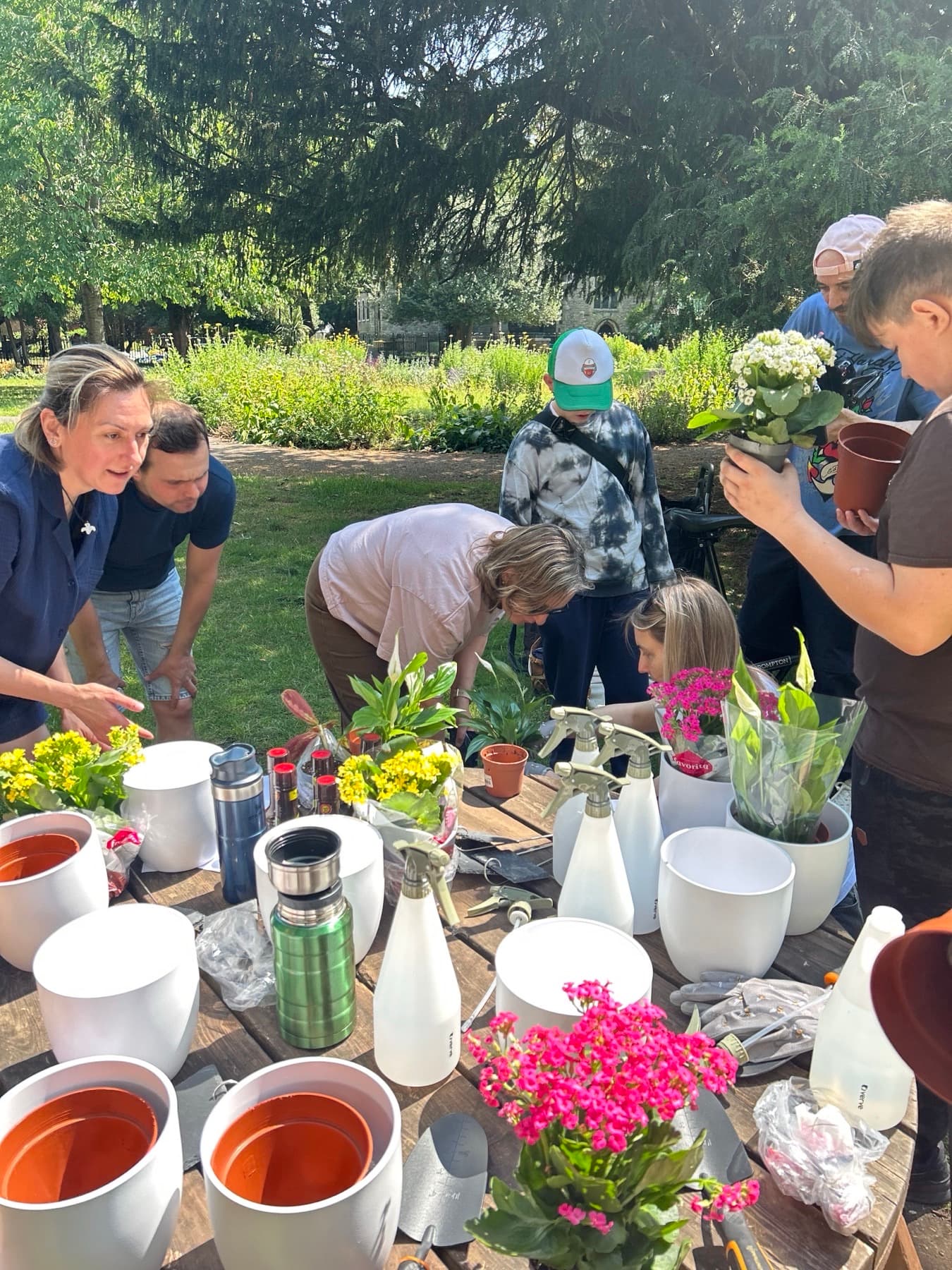 Volunteers working in the raised beds of St Mary's Therapeutic Garden.