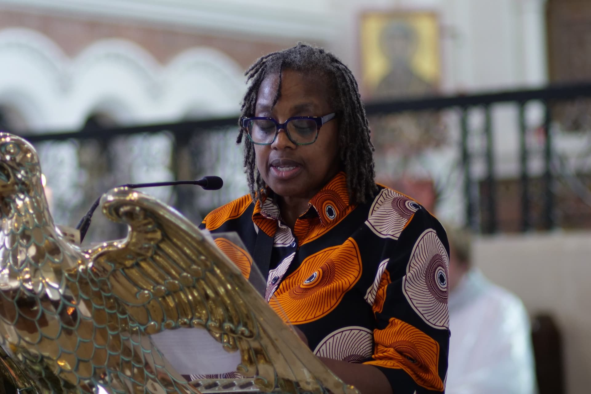 A member of the congregation reading the lesson from the brass eagle lectern.