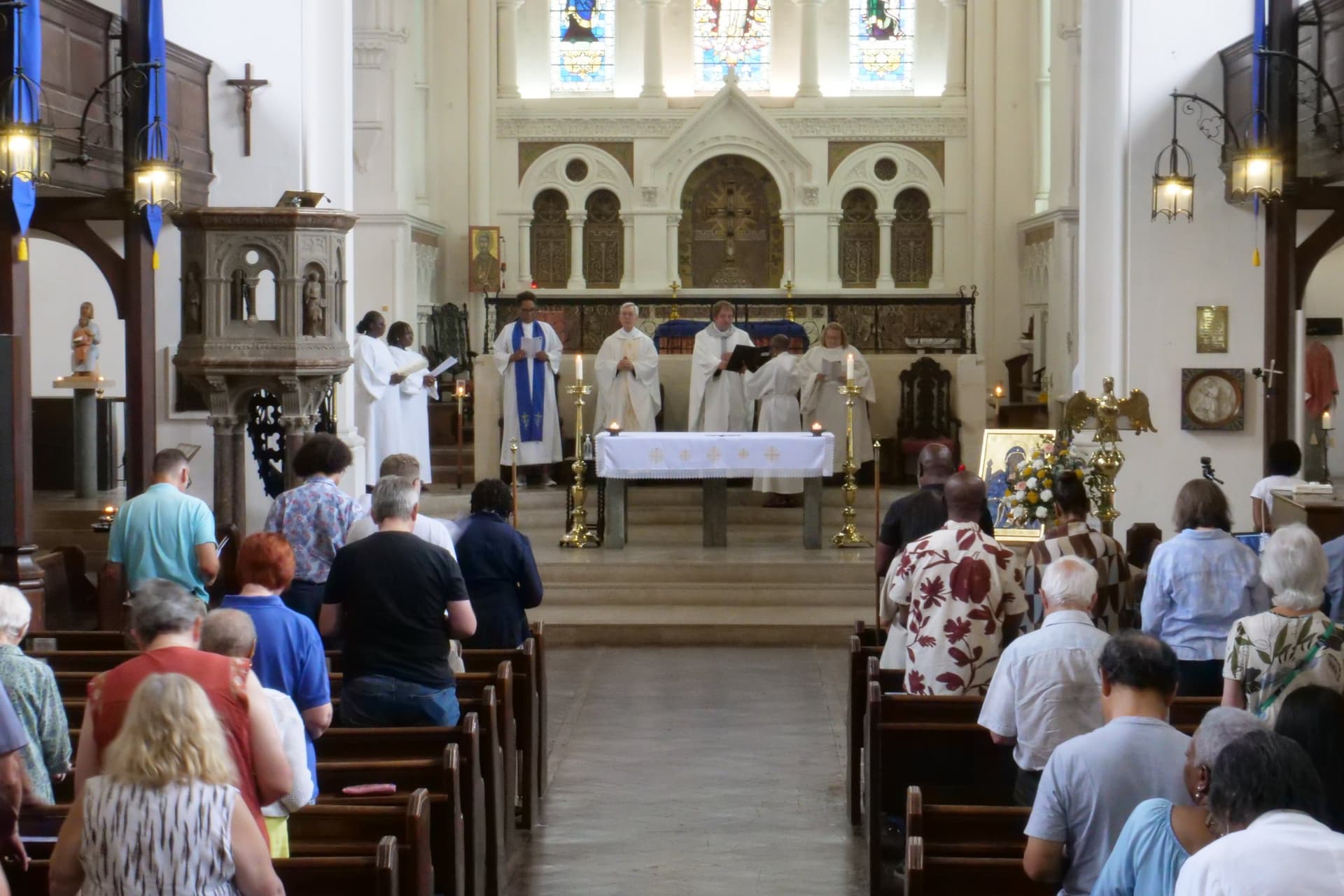The altar during the Sunday Sung Family Mass, with the congregation standing.