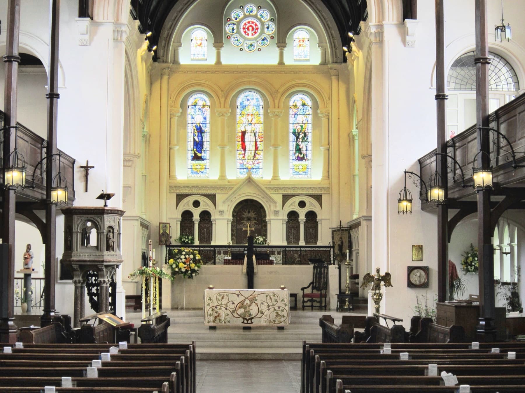 The inside of the church looking east towards the altar, with the arcade of columns either side and the east windows beyond.